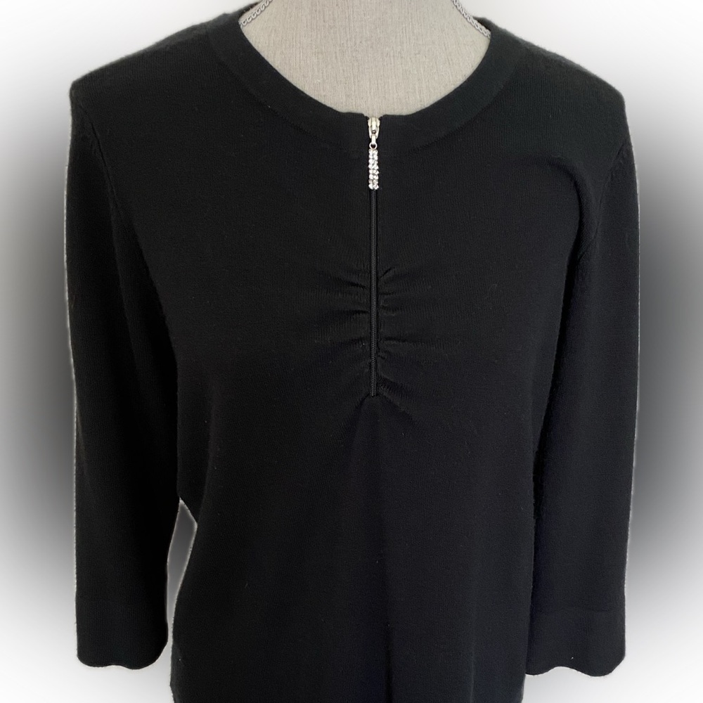 Black cashmere-like sweater with rhinestone toggle